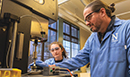 Professor and colleague in lab
